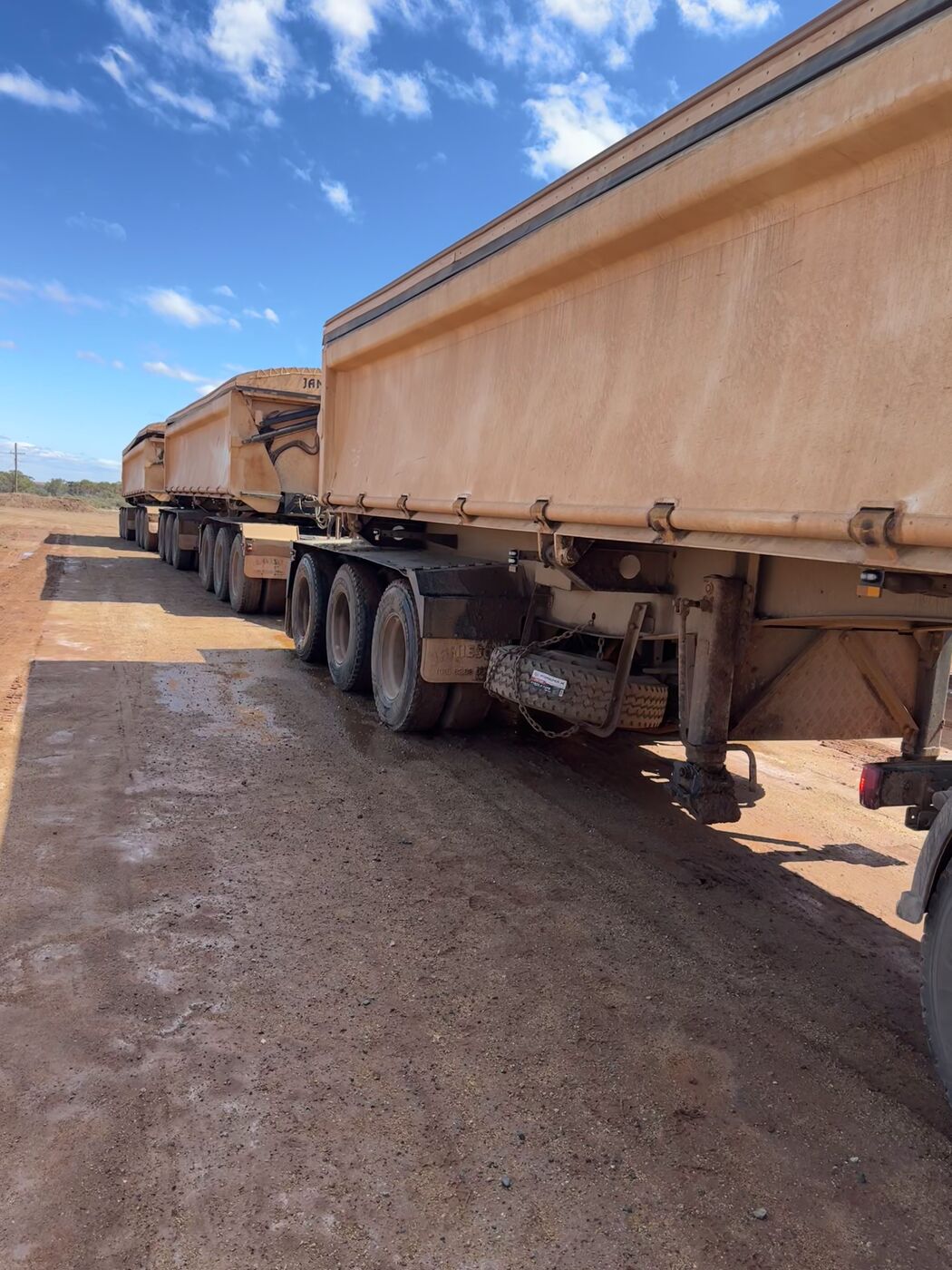 PSSG side-tipper road train on a haul pad